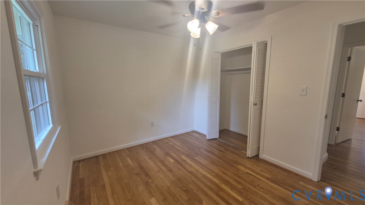 7818 River Road Petersburg, VA 23803 - Photo 11 of 19 Hardwood flooring throughout, featuring a window w