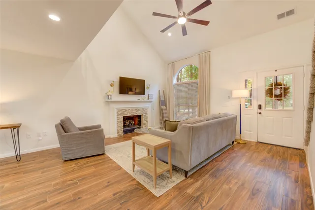 a living room with furniture and a fireplace