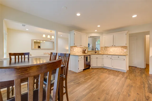 a kitchen with counter top space cabinets and appliances