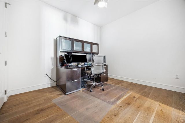 a view of walk in closet with clothes