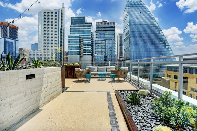 a view of a swimming pool with a lounge chairs