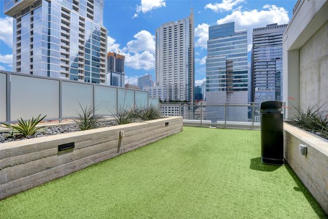 a bathroom with a sink toilet and window