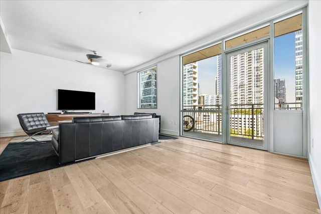 a large kitchen with stainless steel appliances kitchen island granite countertop a large counter top and oven