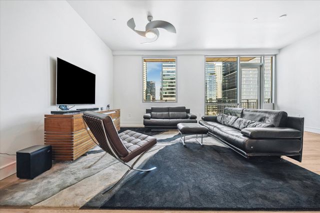 a view of a livingroom with furniture and a window