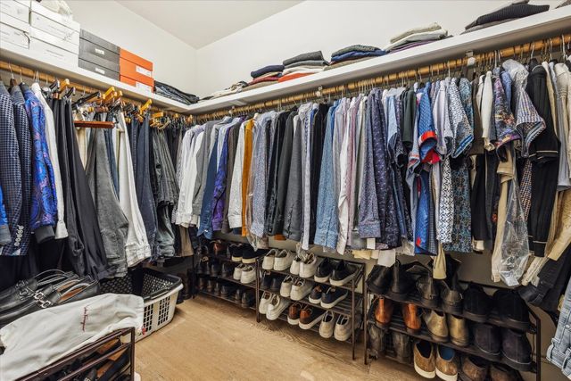 a bathroom with a shower and a glass door