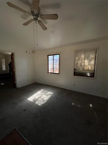 a bed sitting in a room next to a window