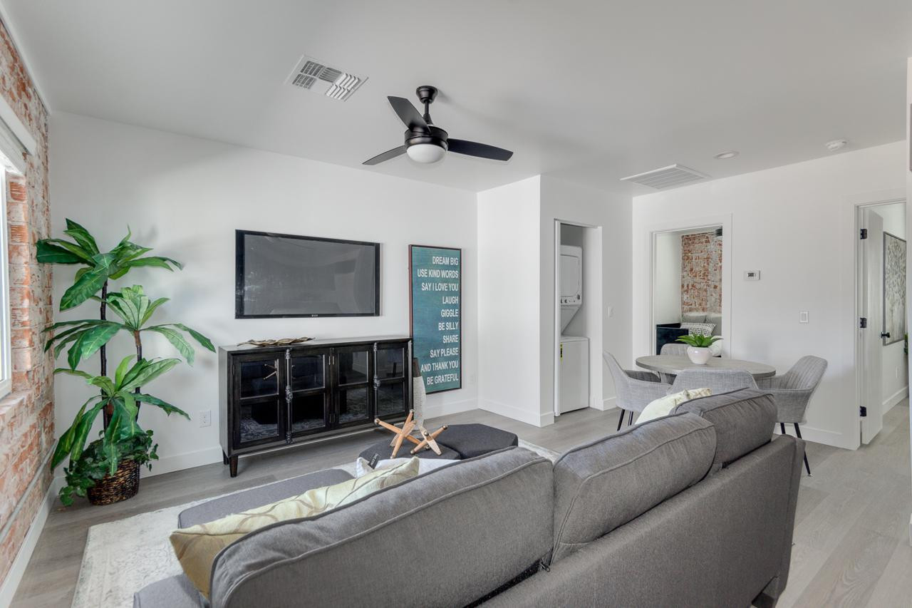 2512 East Thomas Road, Unit 1 Phoenix, AZ 85016 - Photo 5 of 24 a living room with furniture and a flat screen tv