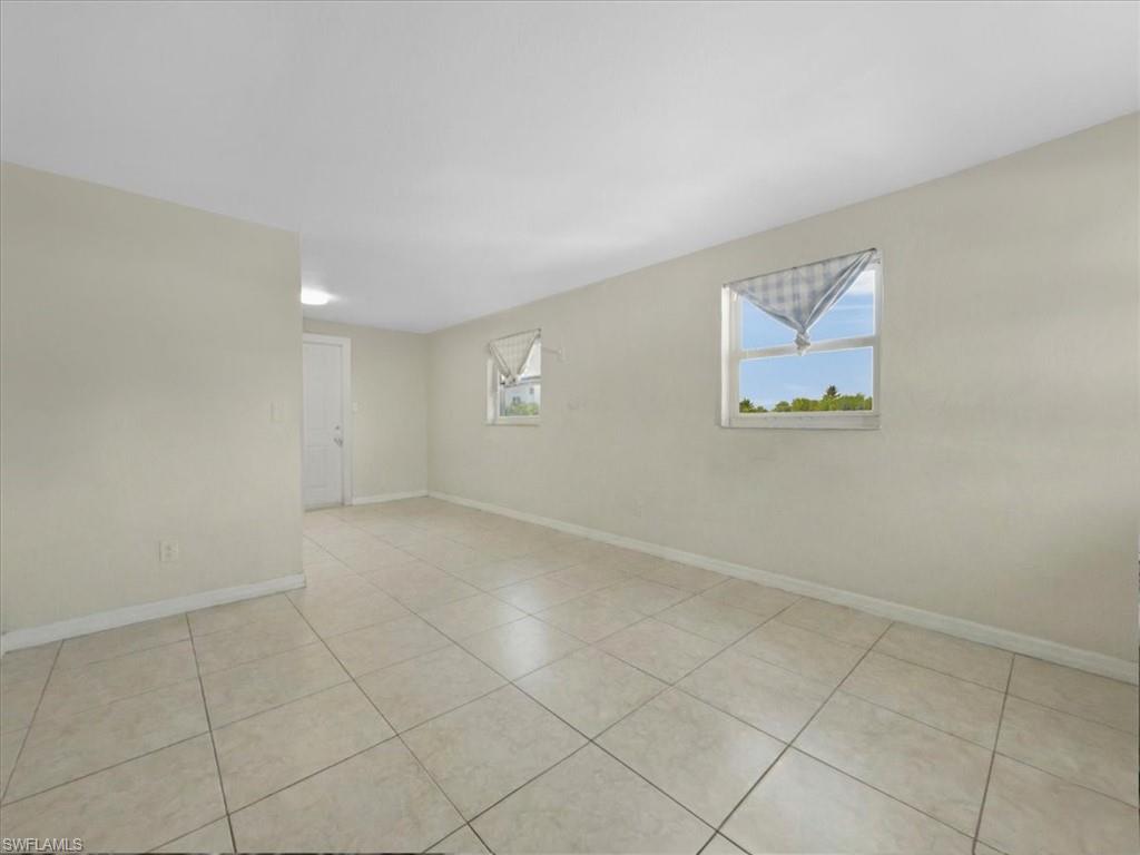 2495 Bayside Street Naples, FL 34112 - Photo 15 of 36 an empty room with windows