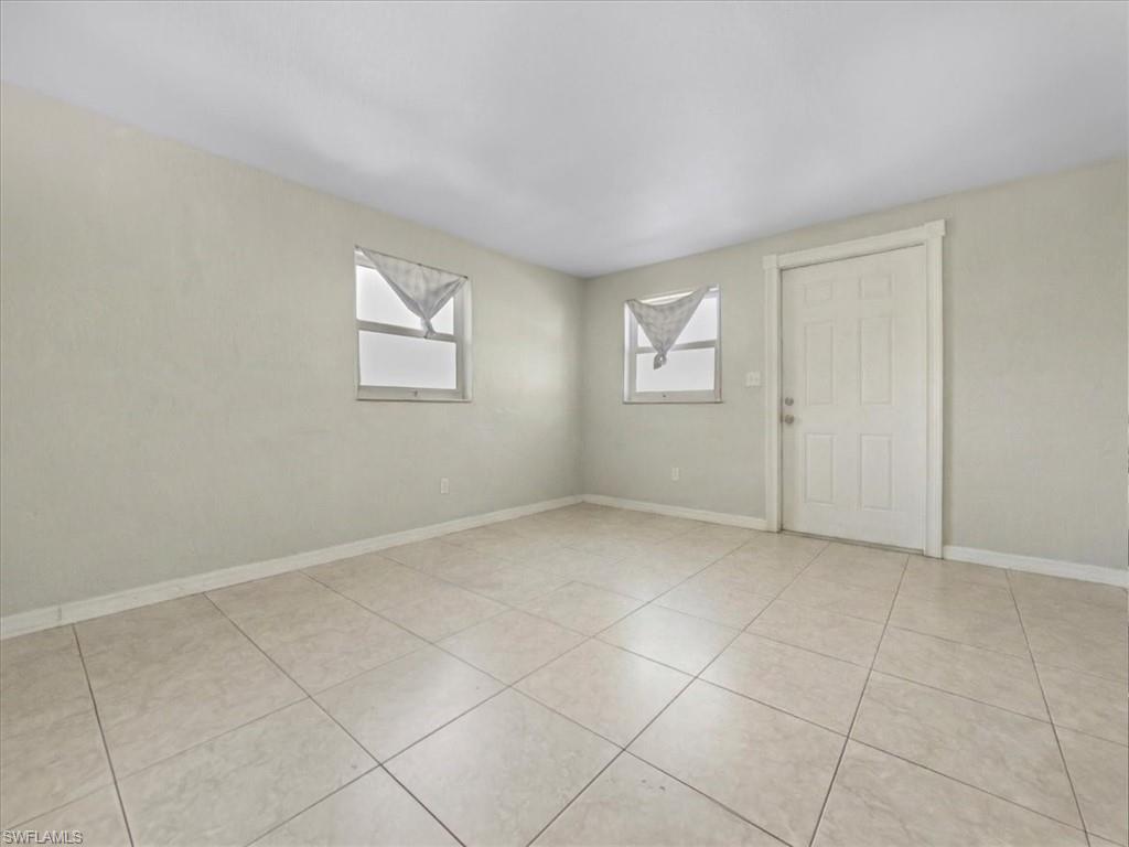 2495 Bayside Street Naples, FL 34112 - Photo 16 of 36 an empty room with windows and closet