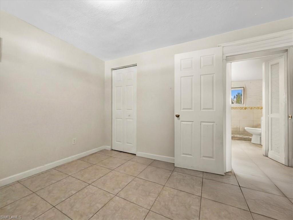 2495 Bayside Street Naples, FL 34112 - Photo 18 of 36 an empty room with a bathroom