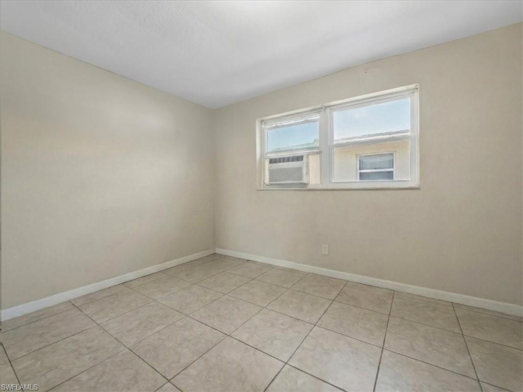 2495 Bayside Street Naples, FL 34112 - Photo 19 of 36 an empty room with windows