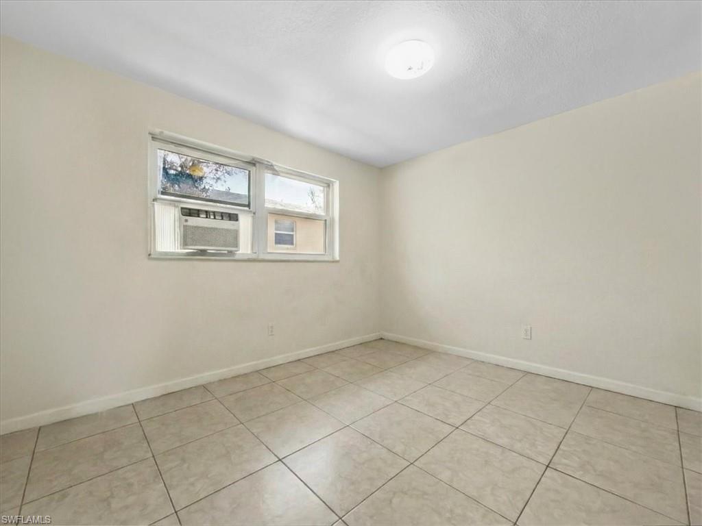 2495 Bayside Street Naples, FL 34112 - Photo 20 of 36 an empty room with windows