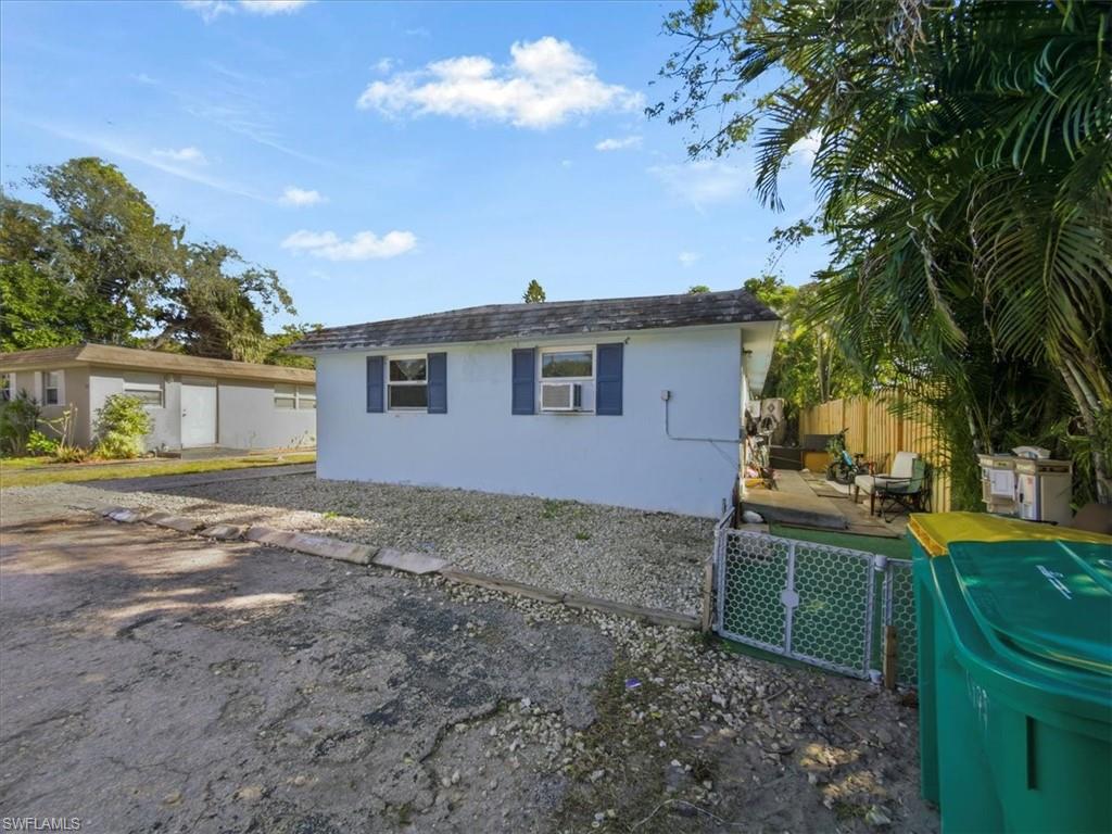 2495 Bayside Street Naples, FL 34112 - Photo 25 of 36 a view of a house with a backyard