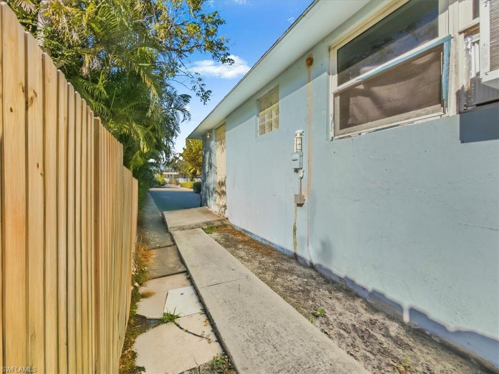 2495 Bayside Street Naples, FL 34112 - Photo 27 of 36 a view of a house with a yard