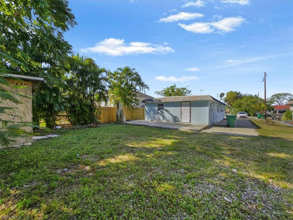 2495 Bayside Street Naples, FL 34112 - Photo 31 of 36 a view of a house with a yard