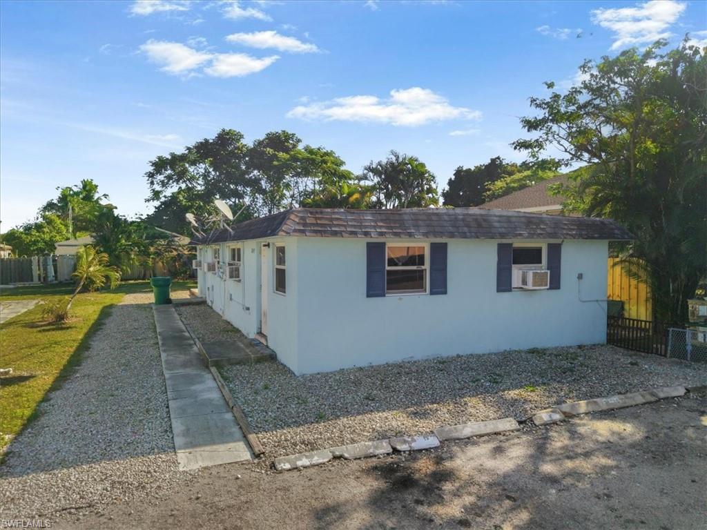 2495 Bayside Street Naples, FL 34112 - Photo 32 of 36 a view of a house with a yard