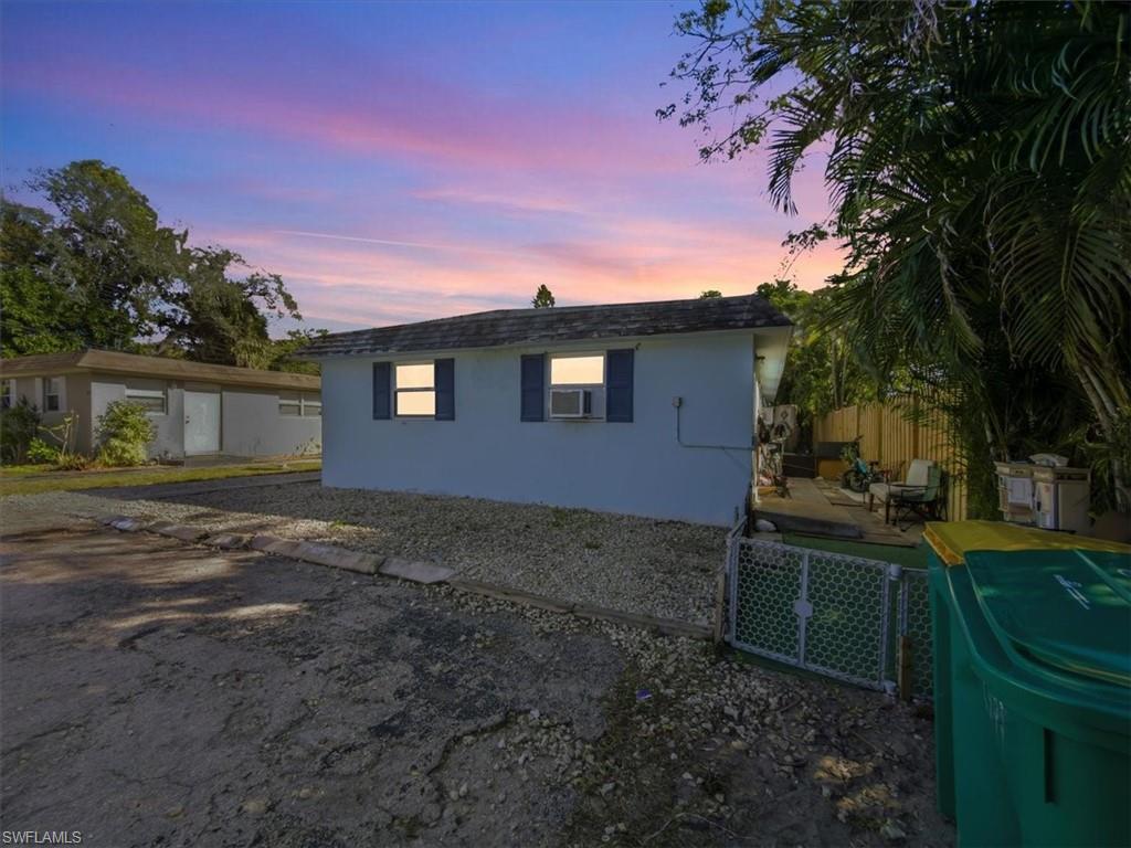 2495 Bayside Street Naples, FL 34112 - Photo 33 of 36 a backyard of a house with lots of green space