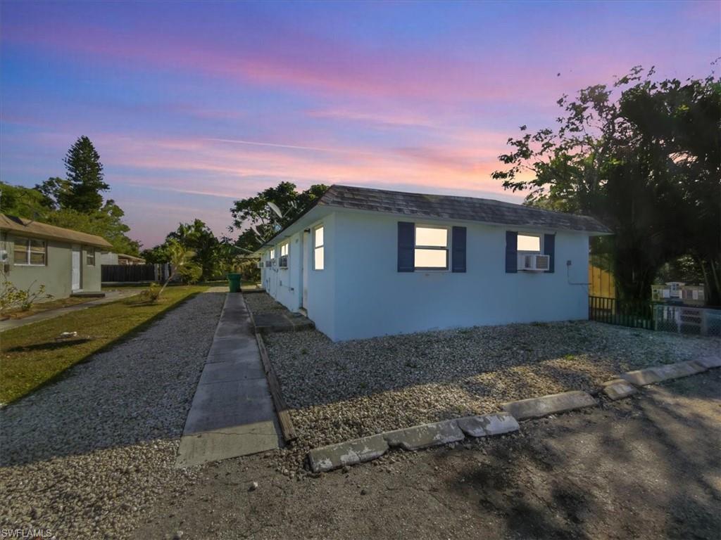 2495 Bayside Street Naples, FL 34112 - Photo 34 of 36 a view of a house with a yard