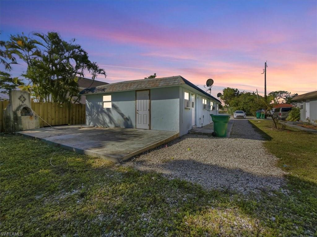 2495 Bayside Street Naples, FL 34112 - Photo 36 of 36 a front view of a house with a yard