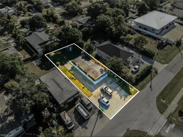 an aerial view of house with a yard