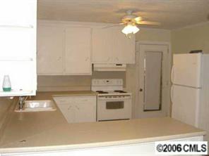 146 East Monbo Road Statesville, NC 28677 - Photo 5 of 5 a kitchen with a stove a refrigerator and a sink
