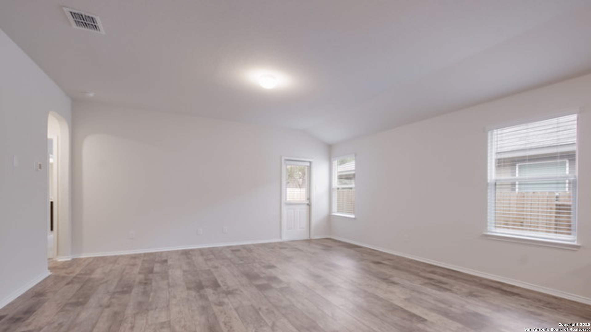 29631 Copper Crossing Bulverde, TX 78163 - Photo 10 of 16 wooden floor in an empty room with a window