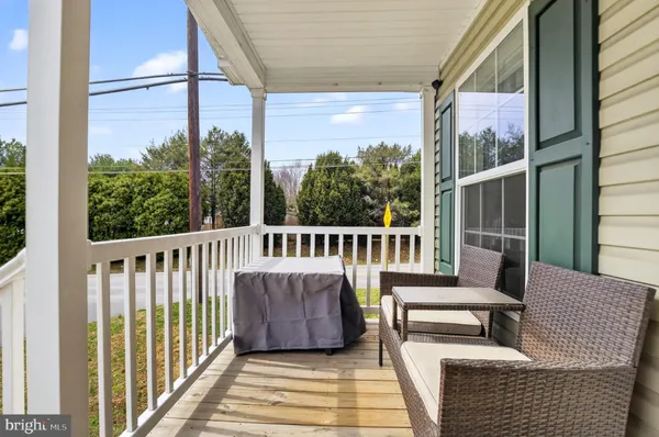 a view of a balcony with chairs