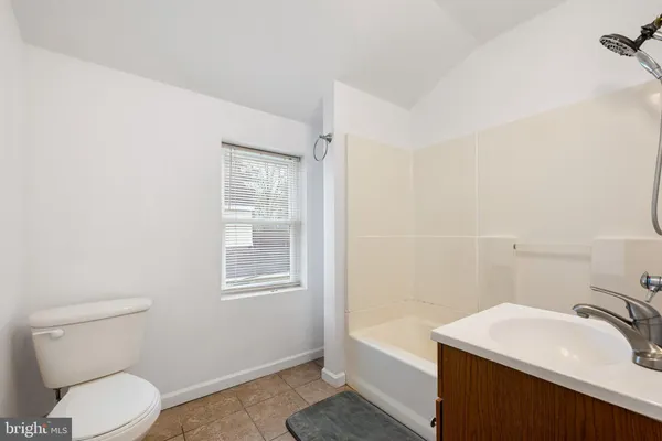 a bathroom with a sink toilet and vanity