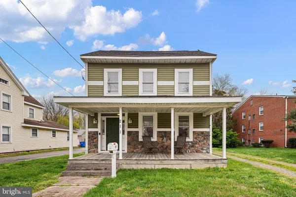 front view of a house with a yard