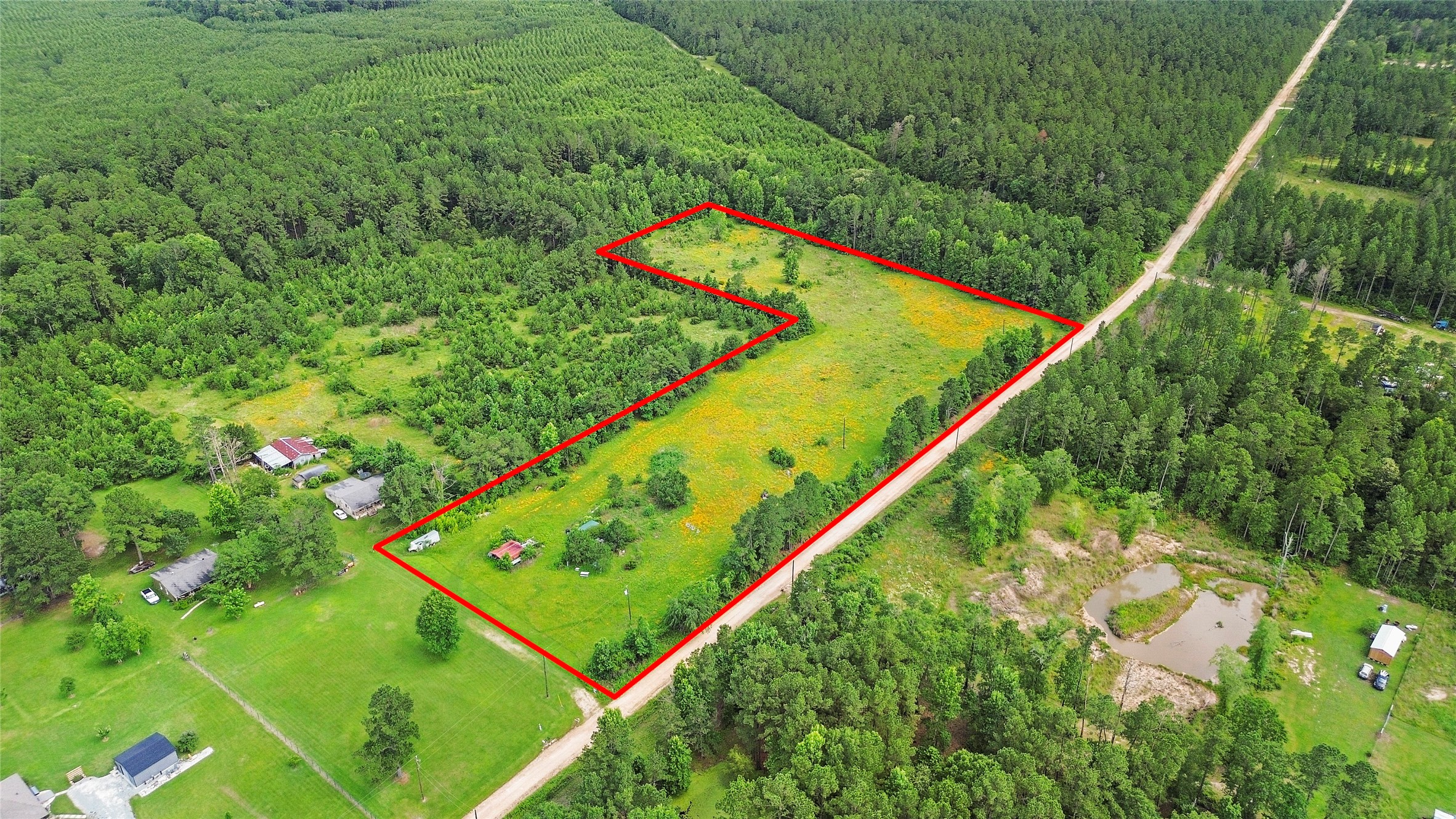 877 Josserand Road Groveton, TX 75845 - Photo 3 of 10 a view of a yard with an outdoor seating