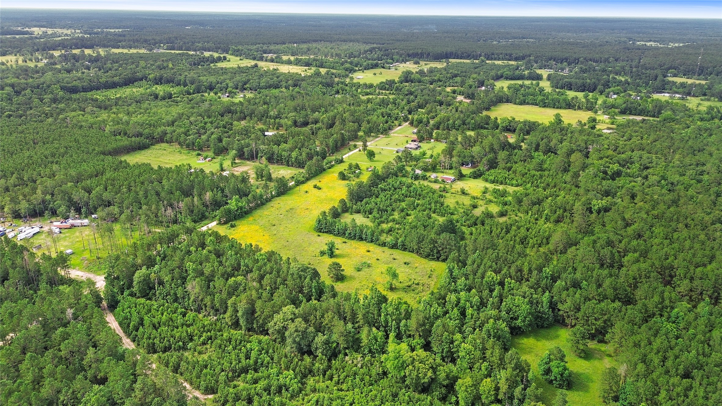 877 Josserand Road Groveton, TX 75845 - Photo 7 of 10 a view of a lake with a city