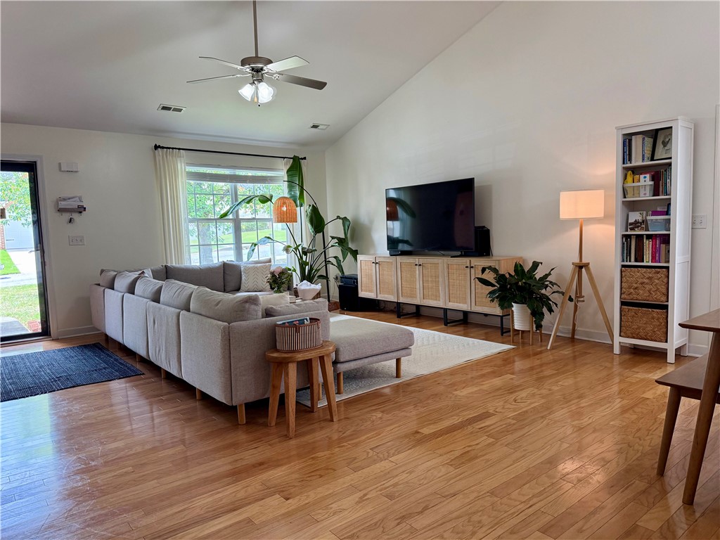 123 Abigail Lane Anderson, SC 29621 - Photo 3 of 22 Bright and airy living room with vaulted ceilings, hardwood floors, and ample natural light.