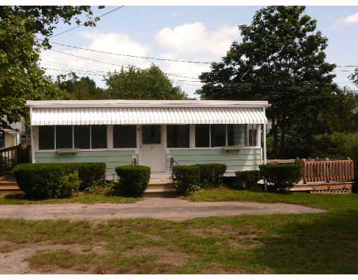 Exterior Front. Charming cottage has private path to Bay, just steps away.