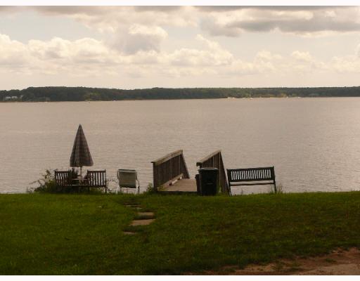 5 Andrew Comstock Road Warwick, RI 02886 - Photo 12 of 12 Waterfront/Dock/Pier. Community boardwalk is steps from the cottage and provides a serene spot to view the Bay. Goddard Park is on the far shore.