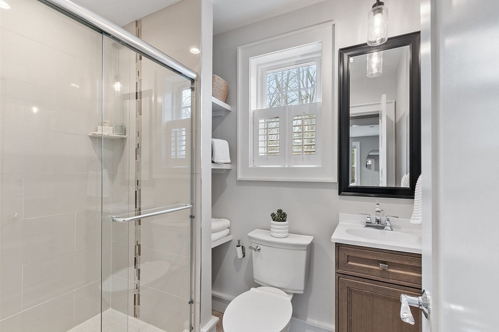 1 Pine Grove Road Medfield, MA 02052 - Photo 18 of 36 a bathroom with a toilet sink shower and mirror