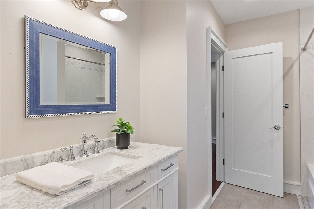 1 Pine Grove Road Medfield, MA 02052 - Photo 19 of 36 a bathroom with a granite countertop sink mirror and vanity
