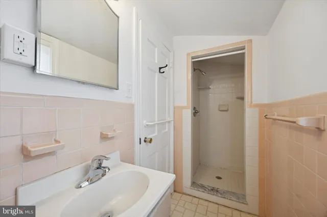 a bathroom with a sink and shower