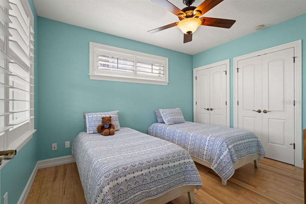 2 Mar Azul North Ponce Inlet, FL 32127 - Photo 13 of 98 a bedroom with two beds and a chandelier