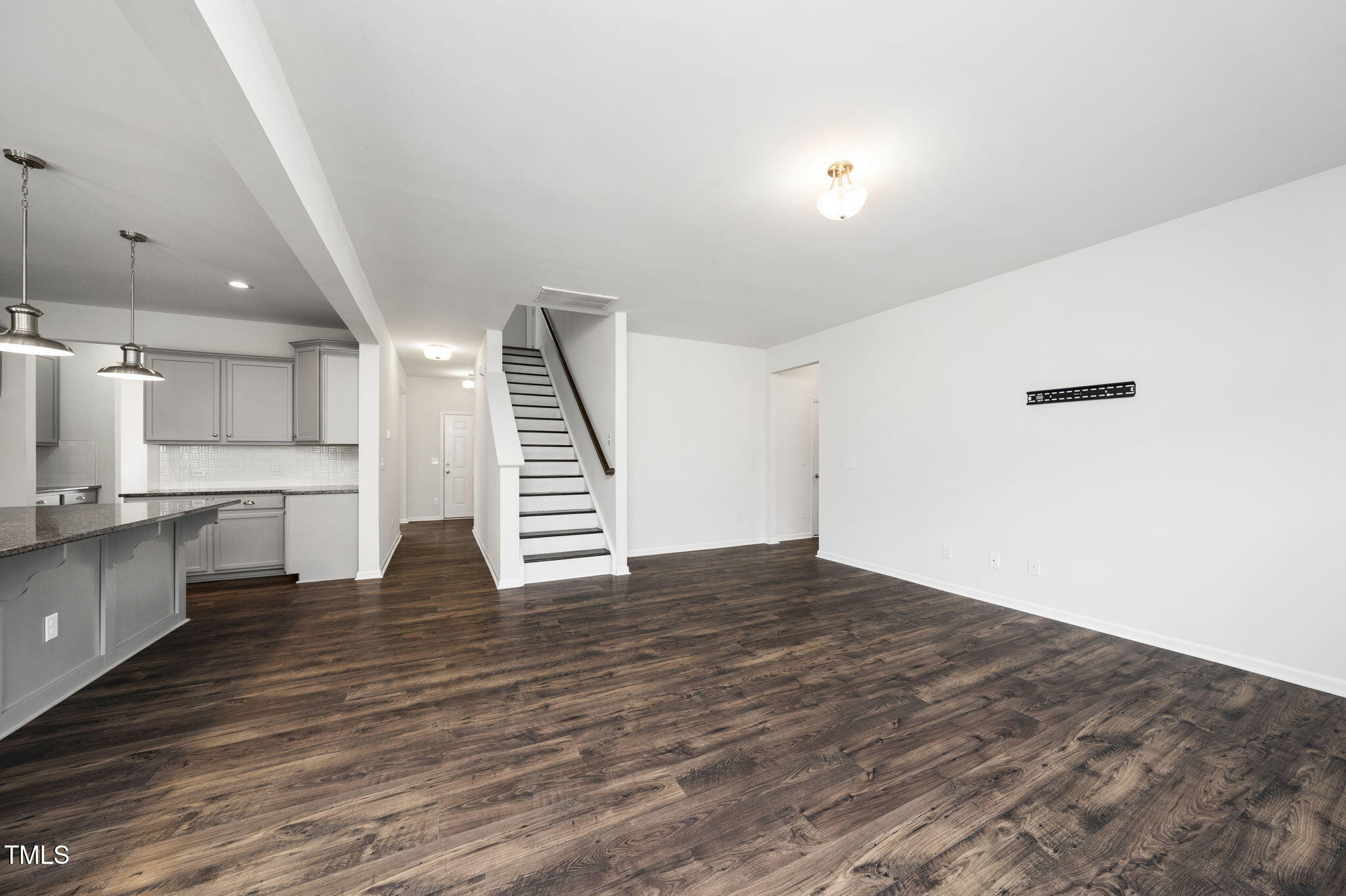 5502 Ripplebrook Drive Durham, NC 27712 - Photo 14 of 50 a view of kitchen and hall with wooden floor
