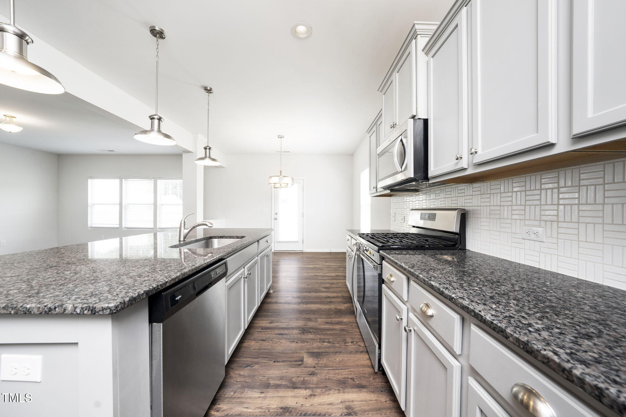 5502 Ripplebrook Drive Durham, NC 27712 - Photo 17 of 50 a kitchen with granite countertop lots of counter top space