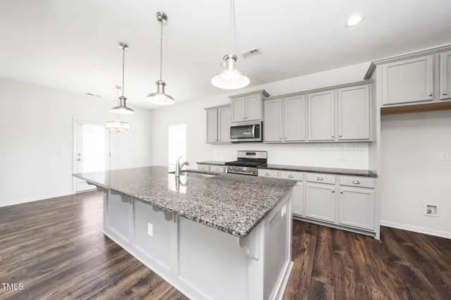 a kitchen with granite countertop lots of counter top space