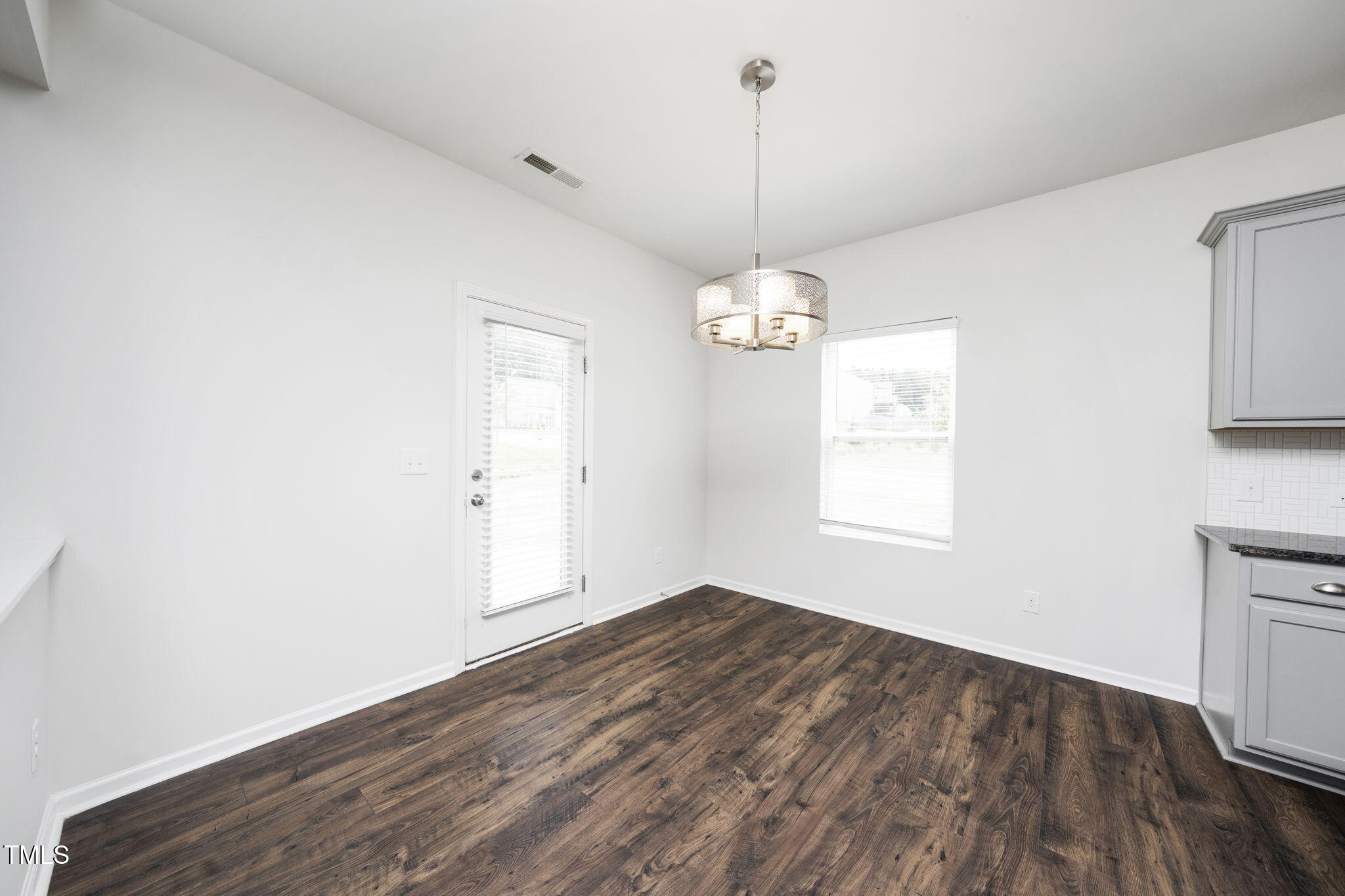 5502 Ripplebrook Drive Durham, NC 27712 - Photo 24 of 50 wooden floor in an empty room with a window