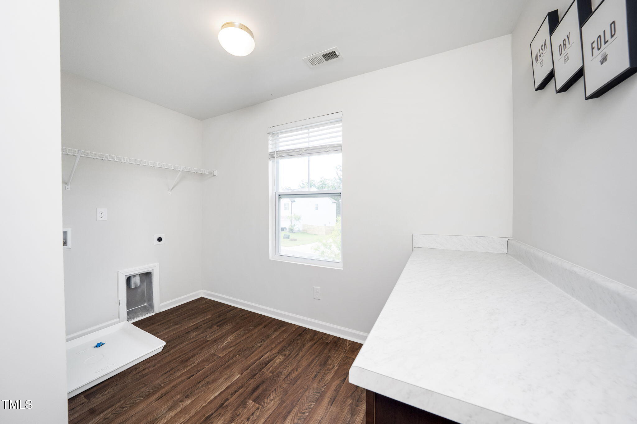 5502 Ripplebrook Drive Durham, NC 27712 - Photo 28 of 50 an empty room with wooden floor and windows