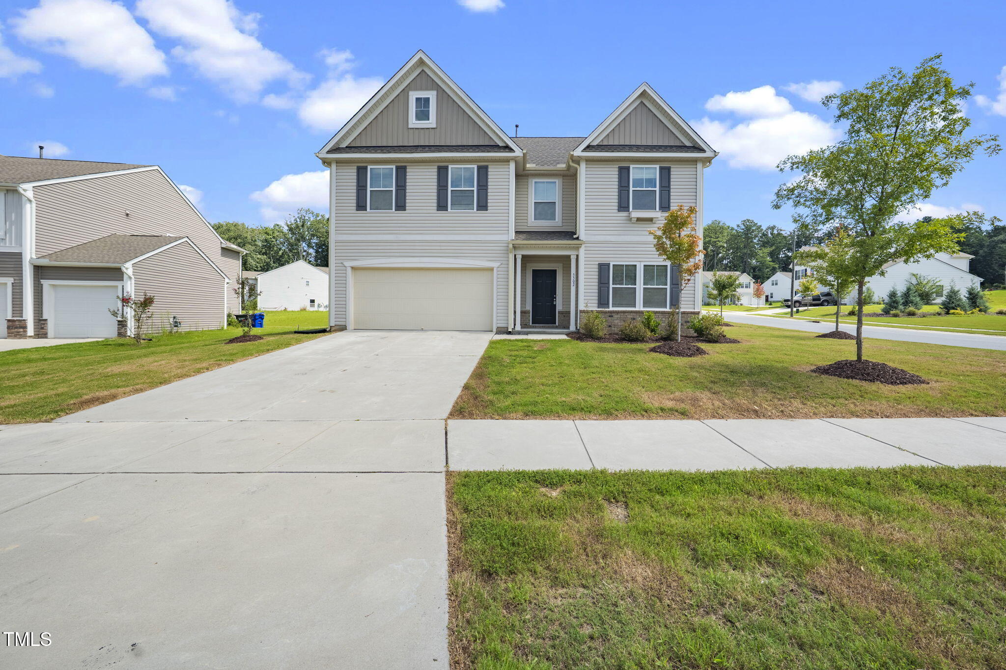 5502 Ripplebrook Drive Durham, NC 27712 - Photo 2 of 50 a front view of a house with a yard