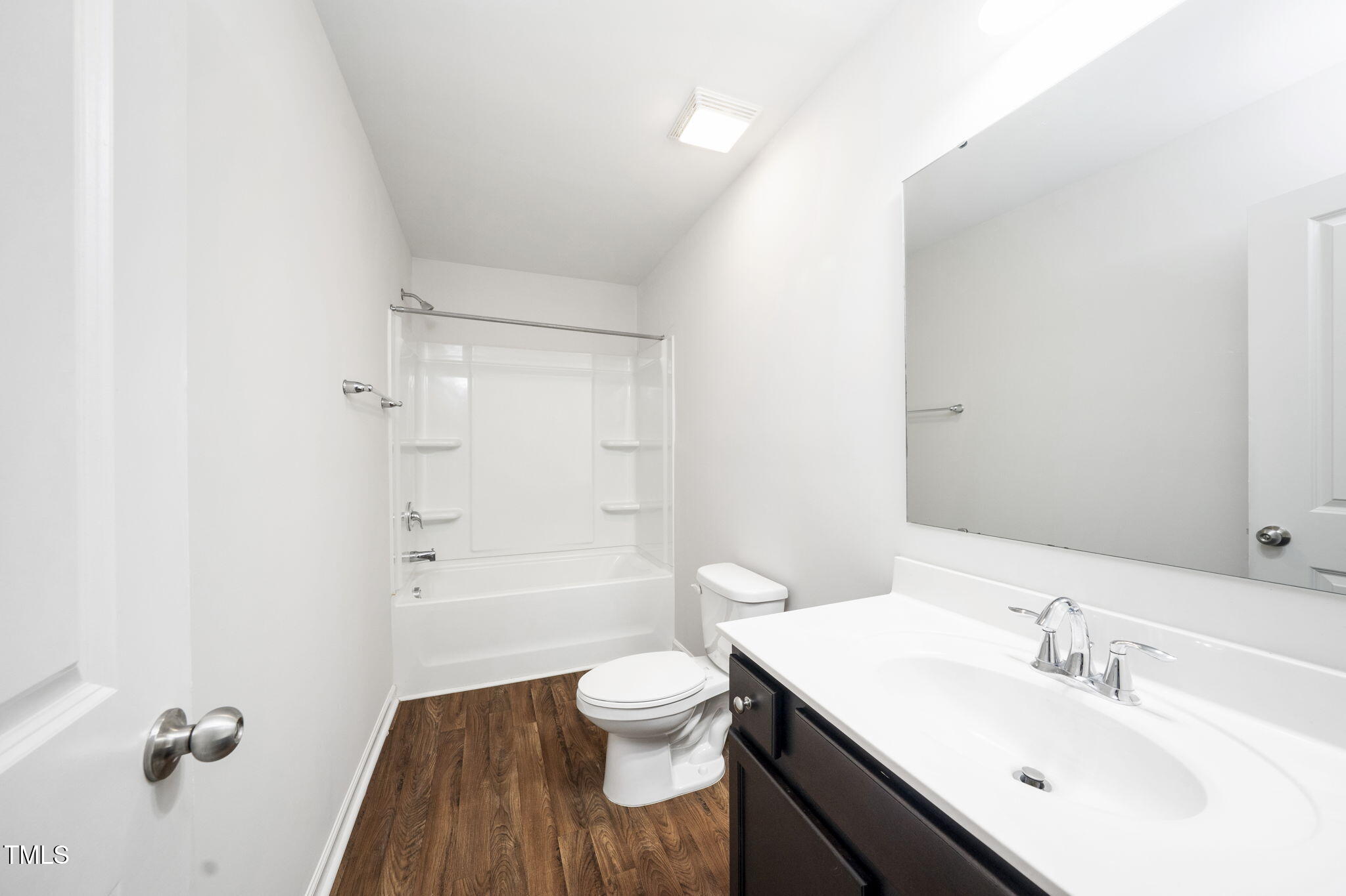 5502 Ripplebrook Drive Durham, NC 27712 - Photo 37 of 50 a bathroom with a sink a toilet and shower