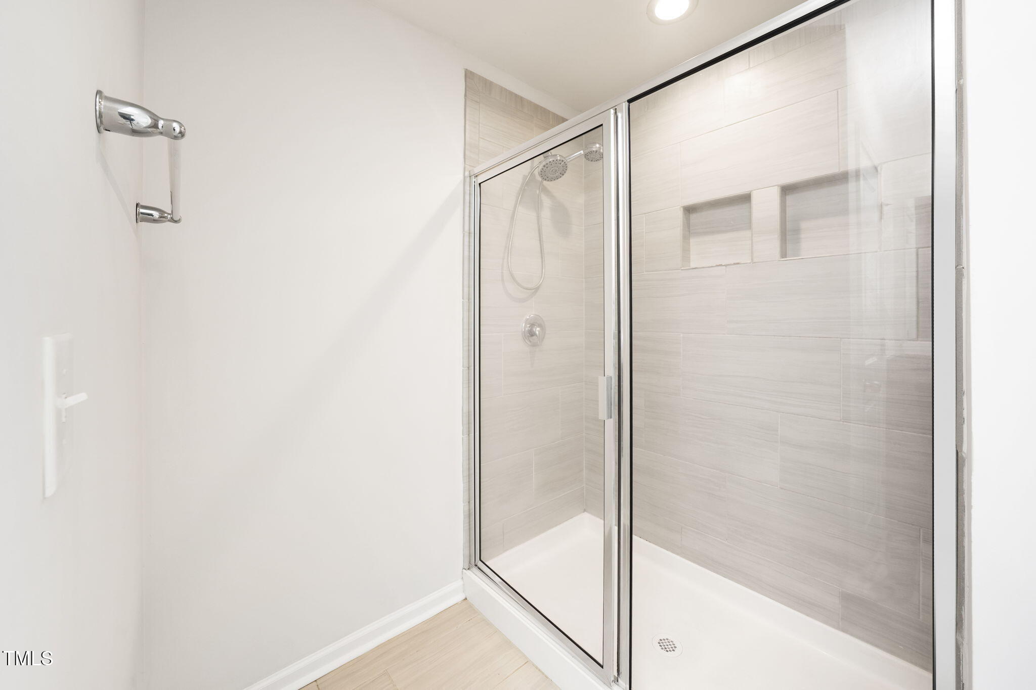 5502 Ripplebrook Drive Durham, NC 27712 - Photo 40 of 50 a bathroom with a glass shower door