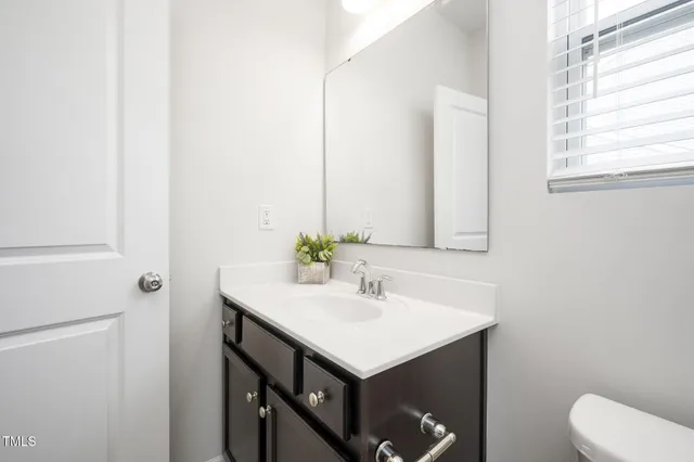 a white bath tub sitting next to a window