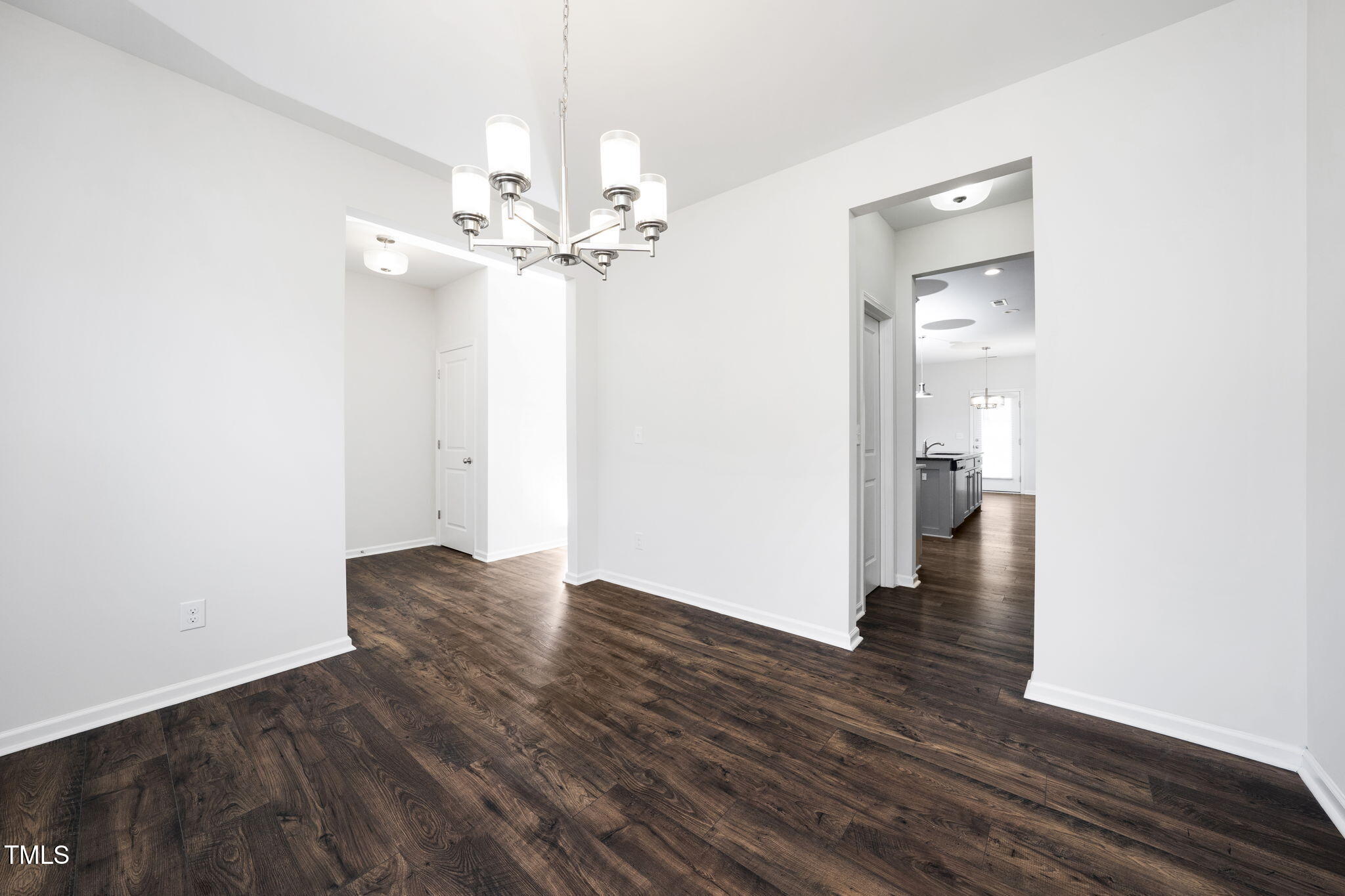 5502 Ripplebrook Drive Durham, NC 27712 - Photo 8 of 50 wooden floor in an empty room with a window