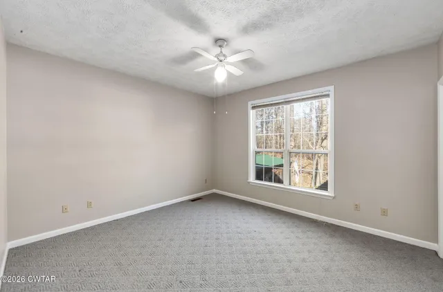 a bathroom with a granite countertop sink toilet a mirror and shower