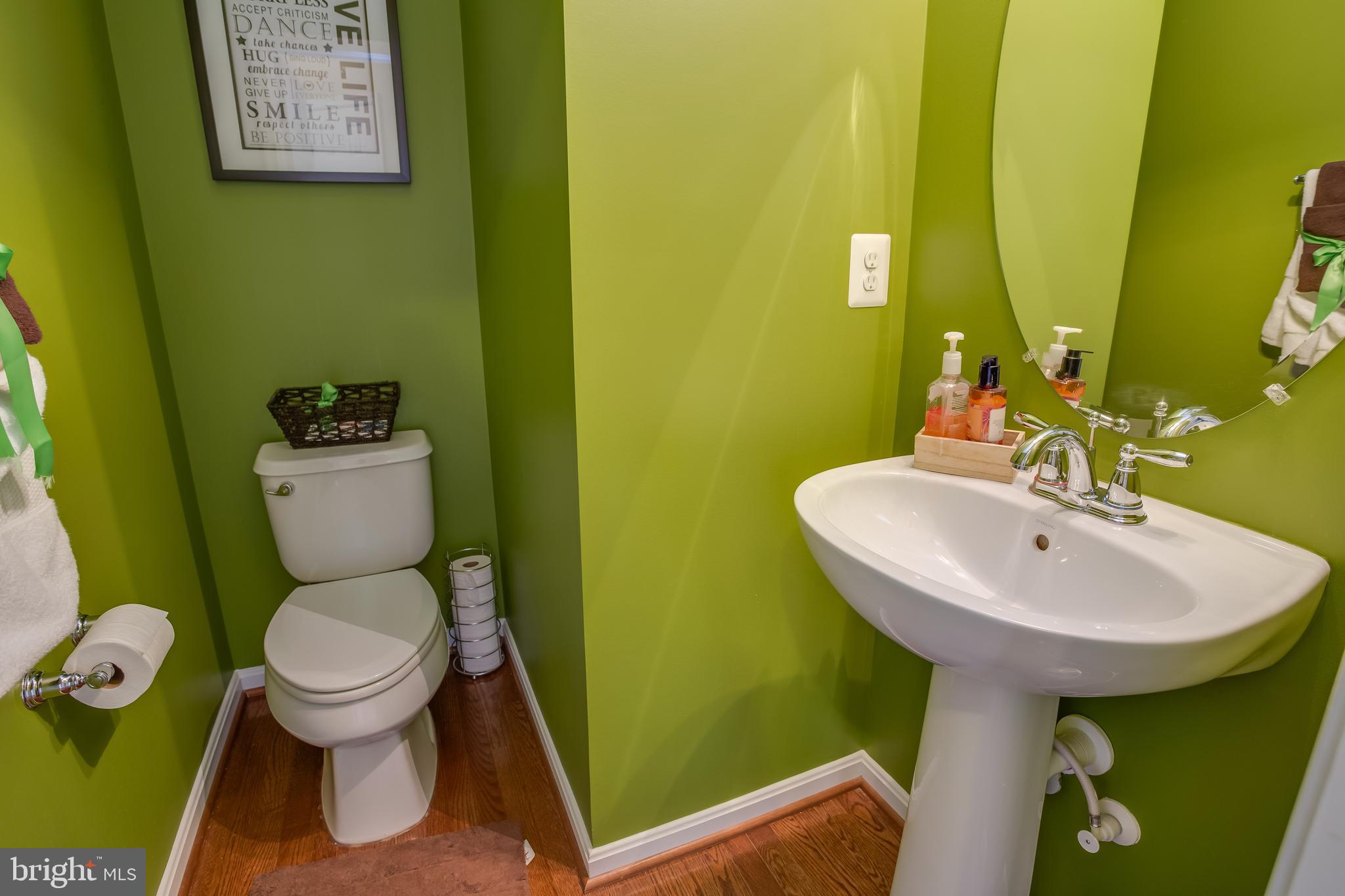 3437 Eagle Ridge Drive Woodbridge, VA 22191 - Photo 13 of 40 a bathroom with a toilet sink and mirror